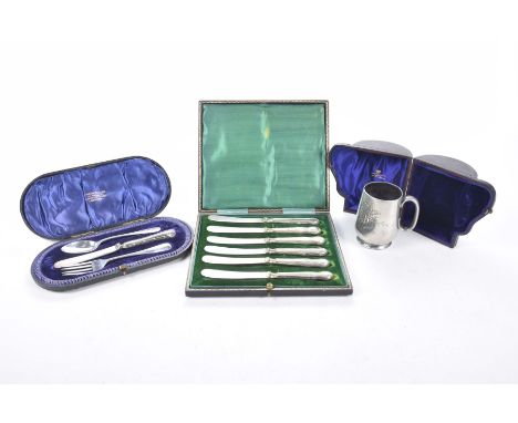 A silver christening setComprising; knife, fork and spoon, cased, Birmingham 1942, together with, a silver plated christening