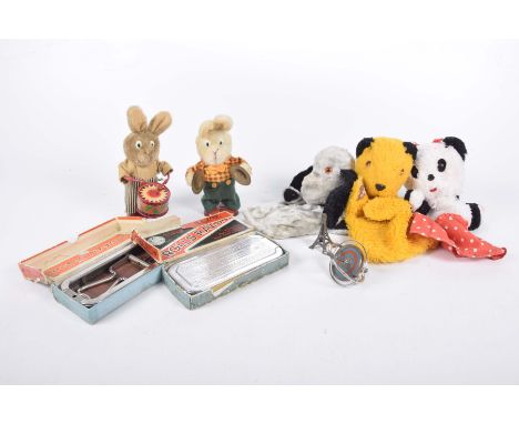 A collection of toys to include puppets Sooty & Sweep & SooWind up cymbal rabbit, further example playing a drum etc.