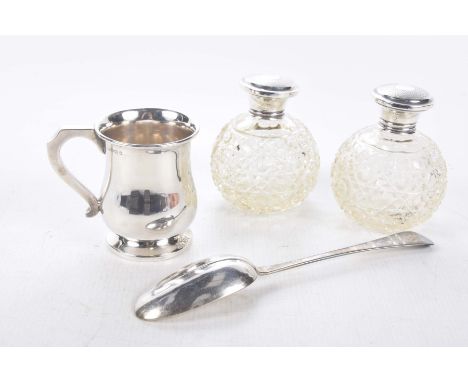 Two silver lidded cut-glass toilet bottlesWith engine turned decoration, marks indistinct, together with a plain silver tanka