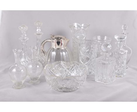 A large quantity of glasswareTo include impressive cut glass vase, height 30cm, a silver plated mounted water jug, fruit bowl