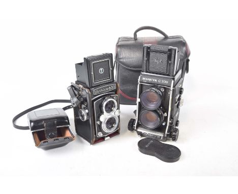 A Mamiya  C330 Medium Format Professional F CameraTogether with a Yashica 635 medium format camera.