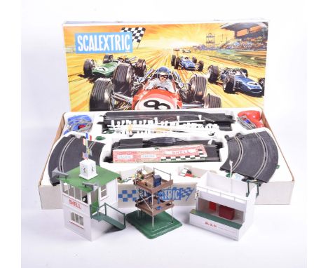 A boxed Scalextric Grand Prix 75 Set With original outer card packaging and three boxed accessories comprising A/203 owners s