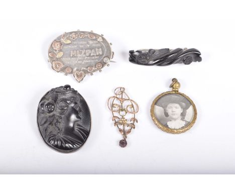 A Victorian 'Mizpah' broochTogether with, two jet brooches, a doublesided portrait pendant and an opendwork yellow metal pend