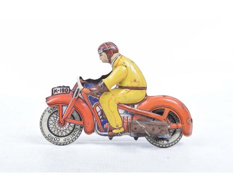 A tinplate clockwork motorbike with riderThe bike No. K-190 in red and blue, the driver wearing yellow outfit and brown helme