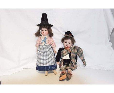 Two German bisque headed dolls by Armand MarseilleComprising a male doll with brown wig, open/shut brown eyes, open mouth, im
