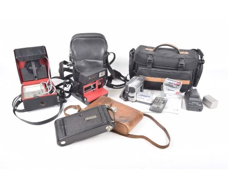 Panasonic NVDS65 video camera complete with charger and batteries, a Polaroid land camera, a vintage Kodak camera, a Minilux 
