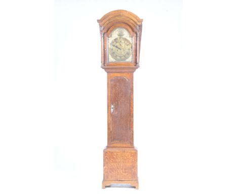 An 18th Century and later oak and mahogany cross banded longcase clockWith a later arched pediment above a brass eleven inch 