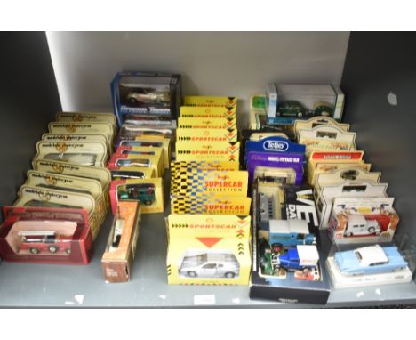 A shelf of modern Die-casts including Matchbox Models of Yesteryear, Maisto Sports Cars, Days Gone etc, all boxed 40+ along w