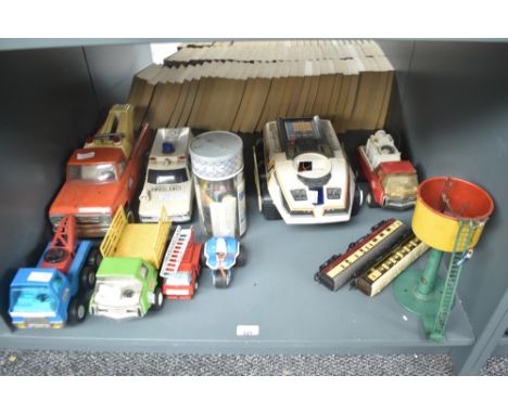 A shelf of Tonka Toys including Tow Trucks, three wheel bike etc along with a BigTrak Toy etc
