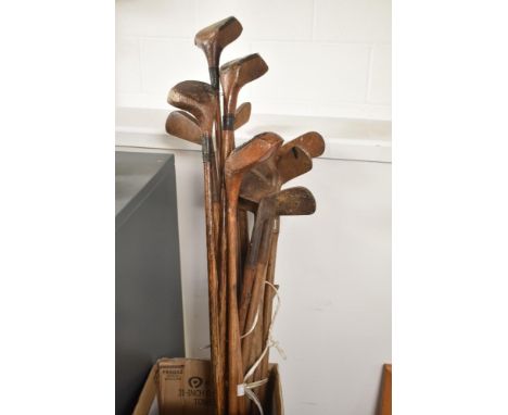 A collection of Hickory Shafted vintage Golf Clubs comprising of four Woods and eleven various Irons and Putters, makers name