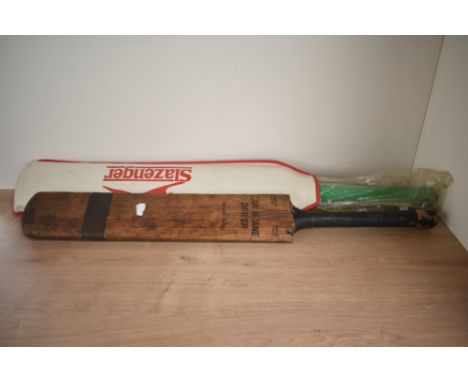 A vintage Cricket Bat, Hurricane Driver Treble Spring along with a later Duncan Fearnley Cricket Bat bearing signatures from 