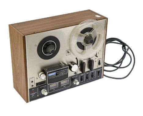 Revox B77 reel-to-reel tape recorder within a tall rack mount