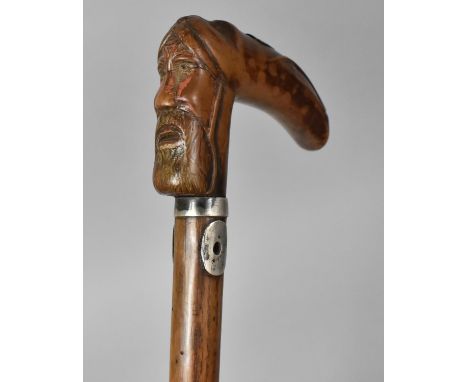 A 19th Century Walking Stick with a Carved Wooden Handle Modelled as a Bearded Man and an Eagles Head, 89cm Long 