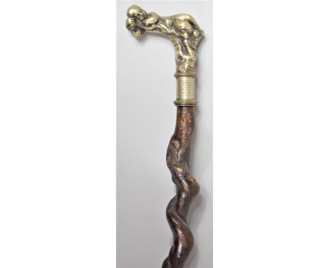 A 19th Century Walking Stick with a White Metal Handle Modelled as a Sleeping Cherub, 88cm long 
