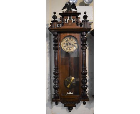 An Edwardian Walnut and Mahogany Vienna Style Wall Clock by Gustav Becker having Half Pilaster Decoration and Eagle Finial. 1