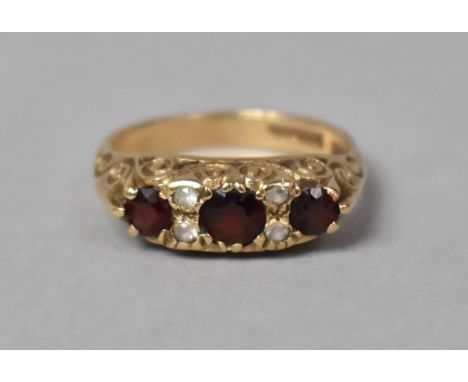 A 9ct Gold Ring Set with Garnets and White Stones, Birmingham Hallmark, 3.9gms, Size P 