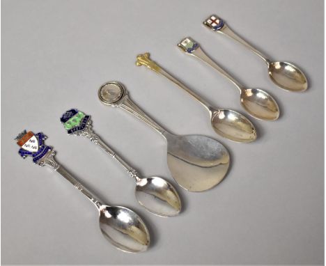 A Collection of Four Enamelled Souvenir Spoons, One Silver Coin Mounted Tea Caddy Spoon and a Silver Fleur De Lys Coffee Spoo