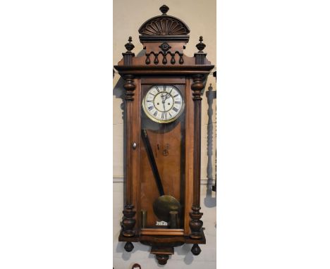An Edwardian Walnut Two Weight Vienna Wall Clock by Gustav Becker with Scrolled Finial. Subsidiary Seconds Dial. 130cms High