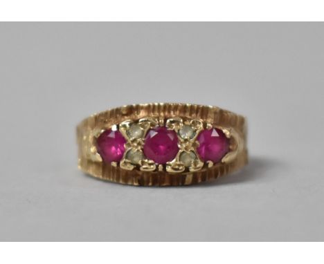A 9ct Gold, Pink Ruby with White Sapphire Vintage Boat Style Ring. Each Ruby Approx .25ct. 3.9gms, Size L.5 