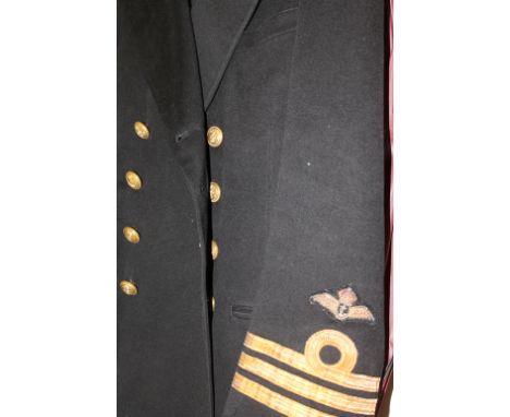 FLEET AIR ARM PILOTS UNIFORM K/C. Two Fleet Air Arm Pilots tunics with Kings Crown buttons and sleeve rank of a Commander (F)