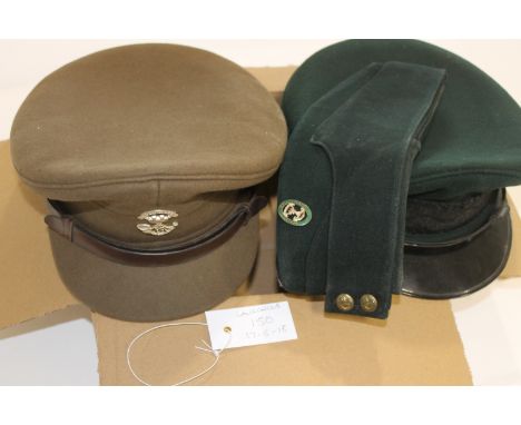 OFFICERS CAPS. Three Officers Caps including a Somerset L I Kakhi peaked example with badge. Another in Green and Black, lack