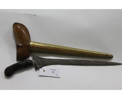 A JAVANESE KRIS or KERIS. A Kris from the Java region with 12.3/4" watered steel pattern blade. Carved wooden hilt with styli