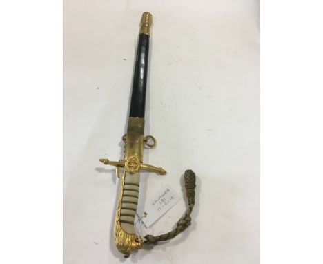 A MIDSHIPMANS DIRK.A George V1 Midshipmans Dirk in superb condition, marked Gieves on the crisply etched blade. Complete with