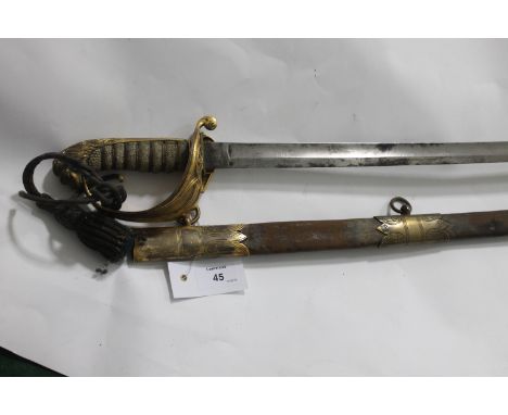 A NAVAL OFFICERS SWORD. A Victorian Naval Officers sword and scabbard , with some rust evident on a 28.3/4" polished blade. P