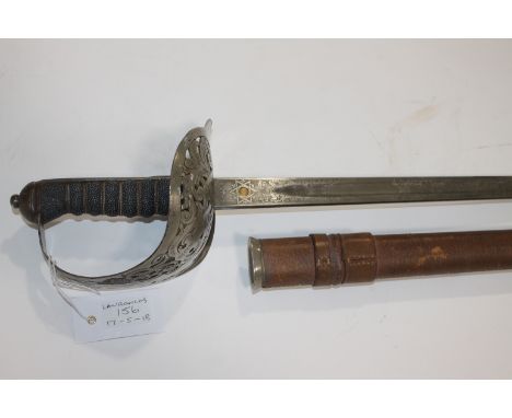 AN OFFICERS SWORD. An 1897 Wilkinson made officers sword and brown leather field scabbard. With various stampings on the 32.1