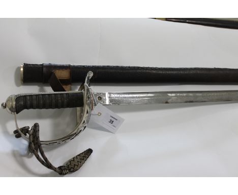A HEAVY CAVALRY OFFICERS SWORD, A George V period heavy cavalry officers sword, complete with a recovered leather scabbard. A