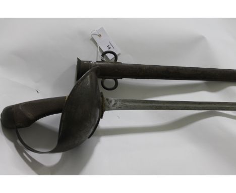 A 1908 CAVALRY TROOPERS SWORD. A Wilkinson made 1908 Pattern Heavy Cavalry Troopers Sword, complete with its steel scabbard. 