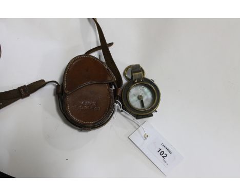A CASED MILITARY COMPASS. A 1907 dated Military compass with unusual mother of pearl dial. Barker & Son of London makers , Pr