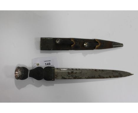A SCOTTISH DIRK. A Scottish Dirk with 9" blade, of classic form, damaged scabbard with both knfe and fork present. Silvered m