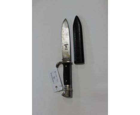 A HITLER YOUTH DAGGER. A Hitler Youth Dagger with plated hilt and badge intact, in a steel scabbard lacking the frog mount. T