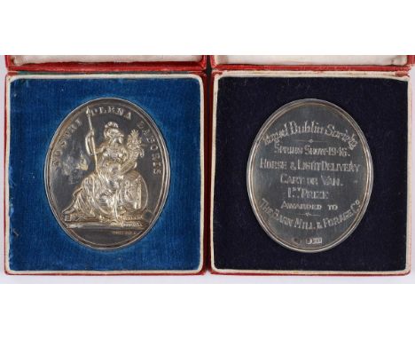 CASED R DUBLIN SOCIETY AWARDS. The first four in Hallmarked Silver of oval form, each weighing some 56 gms. Nostri Plena Labo