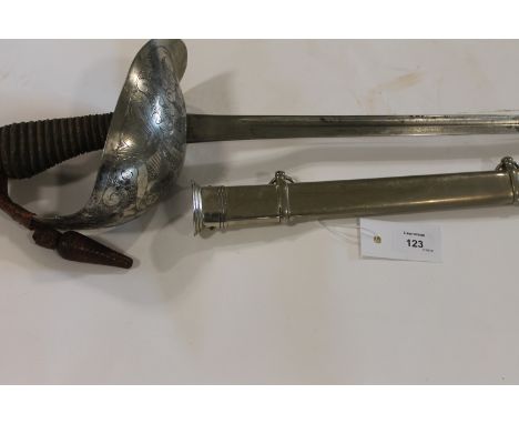 A 1912 PATTERN CAVALRY OFFICERS SWORD. A Cavalry officers 1912 pattern sword, with lightly stained in places, 35" blade. Comp
