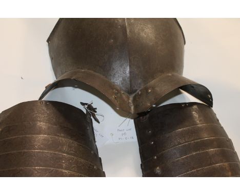 BREAST ARMOUR AND ASSOCIATED TASSETS. A 19thC breastplate with centre-rib and flared thigh mounts, to accept the associated T