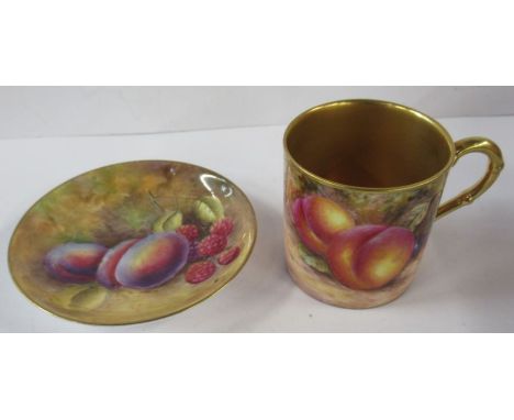 A Royal Worcester coffee can, decorated with fruit by Freeman, together with a Royal Worcester circular dish decorated with f