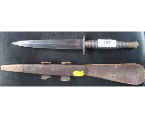 A military issue knife, with scabbard