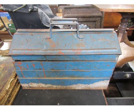A collection of tools, tool boxes, jerry can, etc.