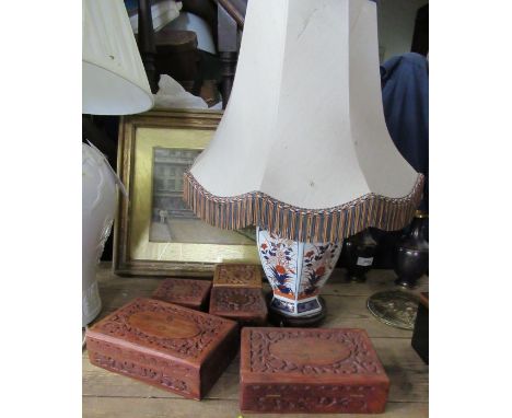 An Imari pattern pottery lamp base, in the Royal Crown Derby style, together with five Eastern style carved wooden boxes