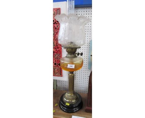 A brass and glass oil lamp, with etched glass shade