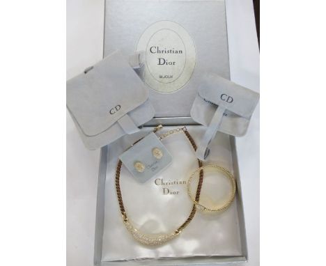 A Christian Dior paste necklace, together with bracelet and earrings, with pouches and box