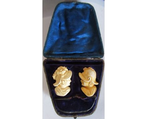 A cased pair of Meerschaum pipe bowls, carved as a man and a woman