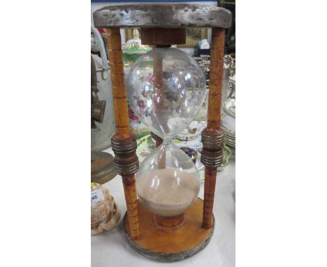 A large wooden framed egg timer, height 14ins