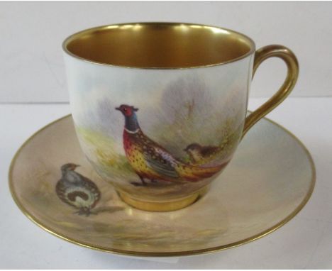A Royal Worcester cabinet cup and saucer, the cup decorated with a Pheasant and the saucer with a Partridge by Maybury