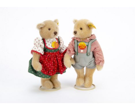 Steiff yellow tagged boy and girl in lederhosen and traditional dress circa 1986, In original boxes —11in. (28cm.) high