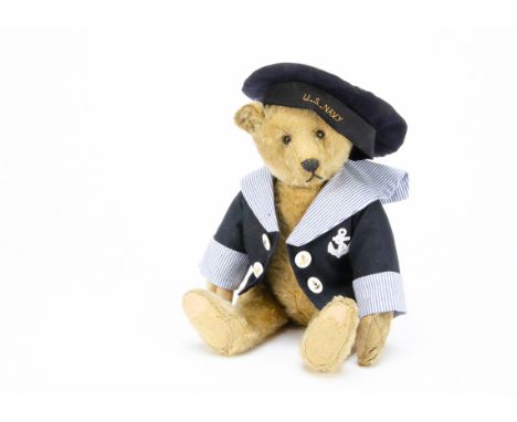 An early Steiff teddy bear circa 1910, with golden mohair, black boot button eyes, pronounced clipped muzzle, replaced black 