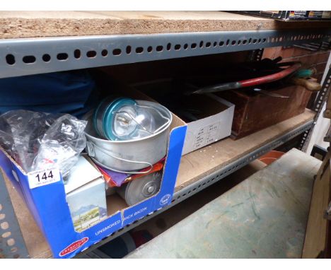 Shelf of mixed items including tools and camping equipment