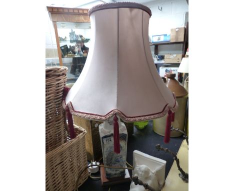 Table lamp and shade on wooden base